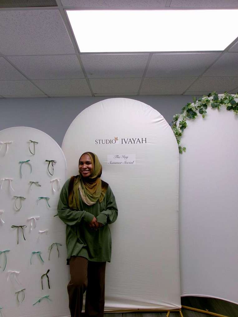 Felecia Abdulla, founder of Studio Ivayah, smiling at an Ivy Summer Social gathering